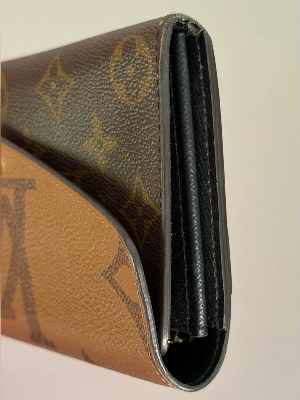 Louis Vuitton Sarah wallet in reverse monogram